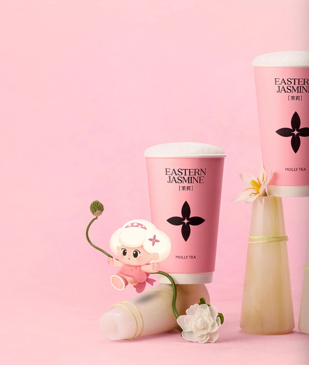Molly Tea jasmine milk tea in pink cups with the Molly character and white flowers